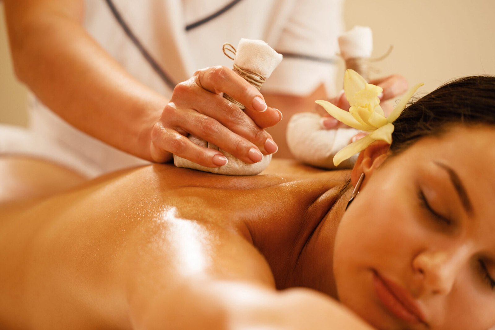 SERVICES Closeup Relaxed Woman Getting Back Massage With Herbal Balls Health Spa Scaled Edited 1